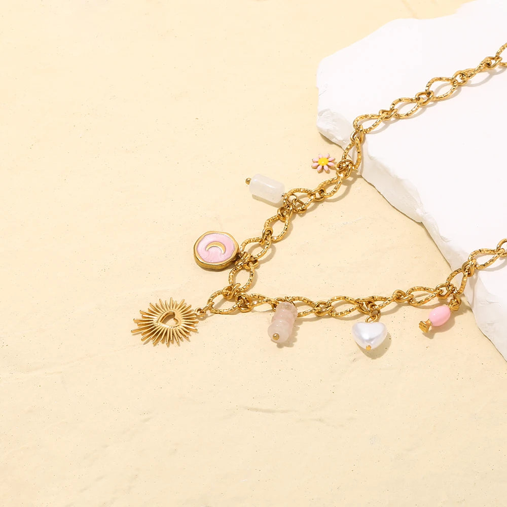 Collana Cuore di Sole – Pendente dorato con charms simbolici