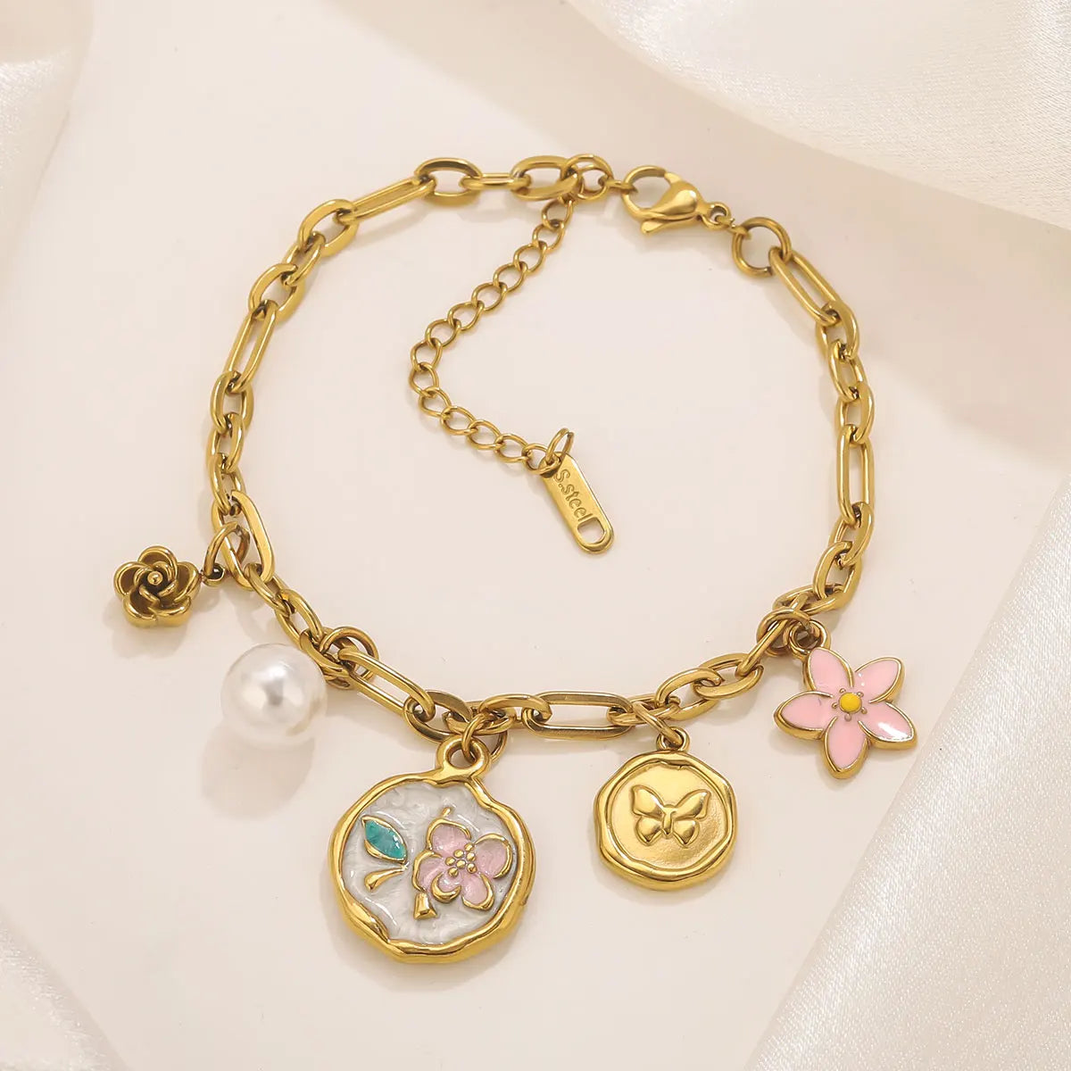 Bracciale bohémien con ciondoli – Stella marina, frutti e fiori