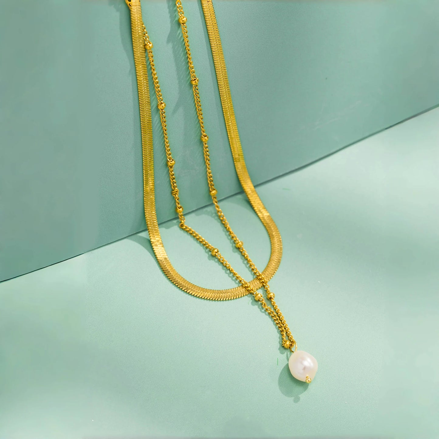 Collana “Doppio Incanto” – Perla & Catena Serpente
