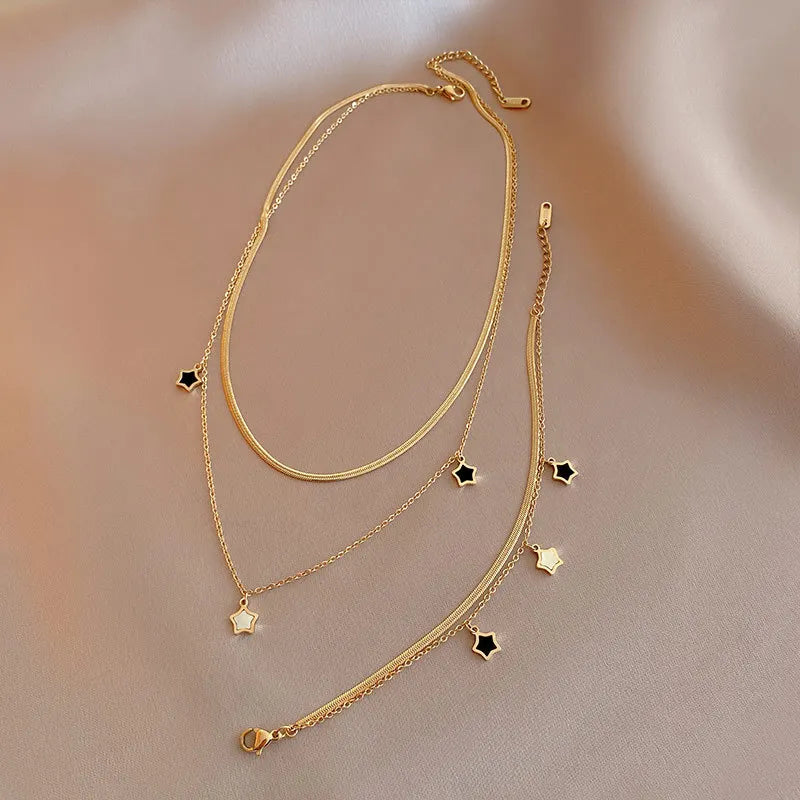 Set collana e bracciale a catena multistrato con stella – Desideri in acciaio