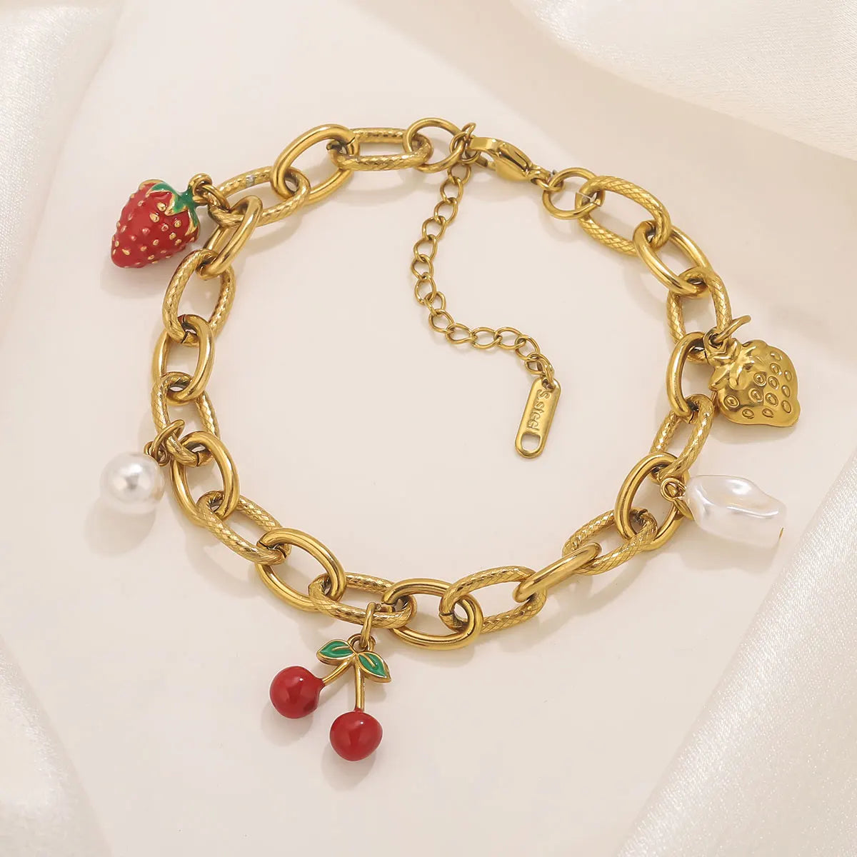 Bracciale bohémien con ciondoli – Stella marina, frutti e fiori