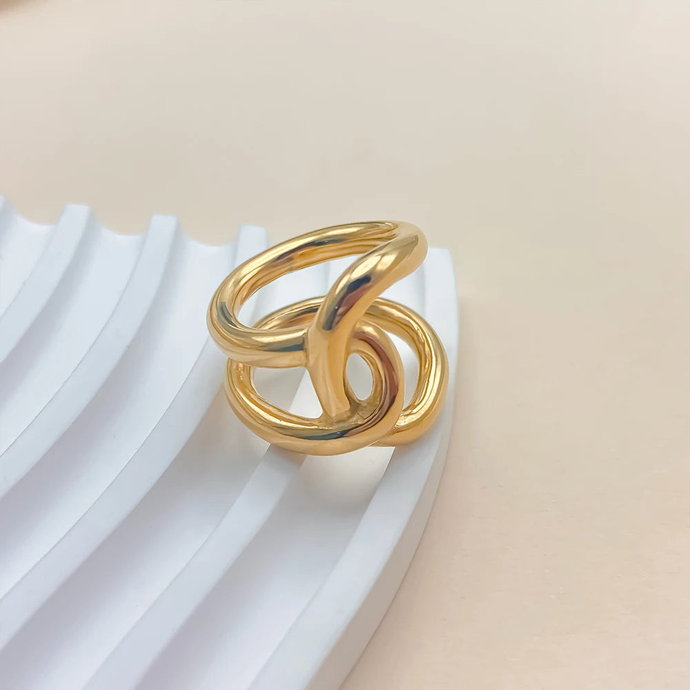 Anello “Twist Knot” – Linee Intrecciate