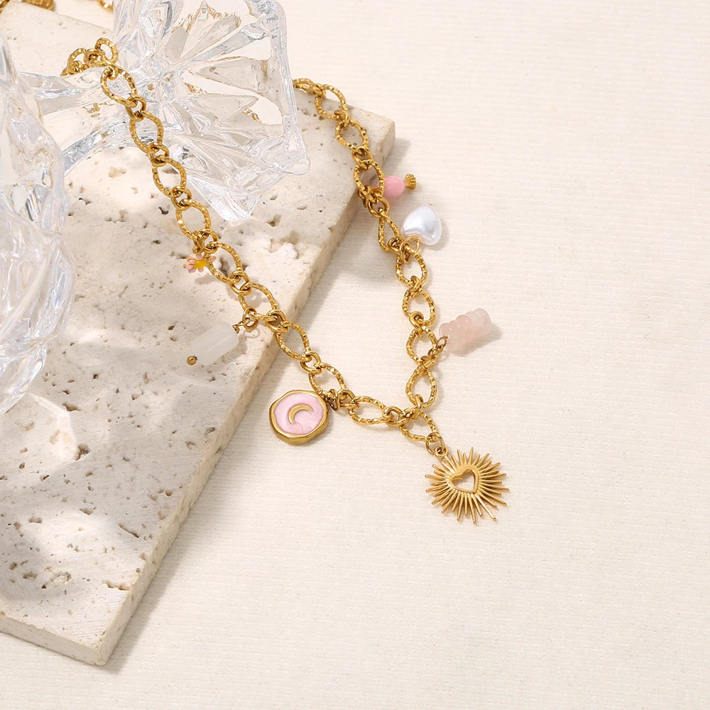 Collana Cuore di Sole – Pendente dorato con charms simbolici