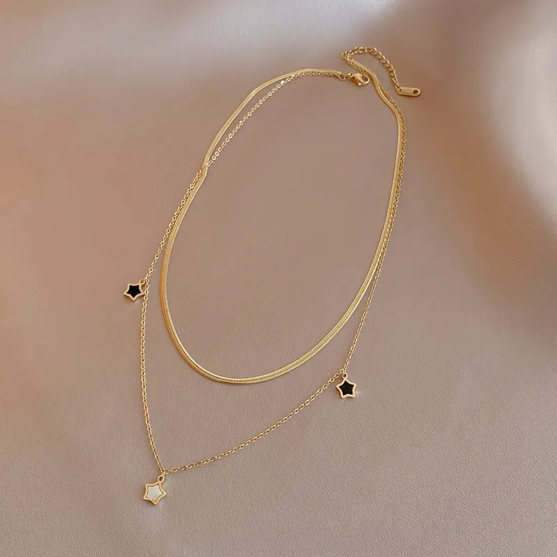 Set collana e bracciale a catena multistrato con stella – Desideri in acciaio