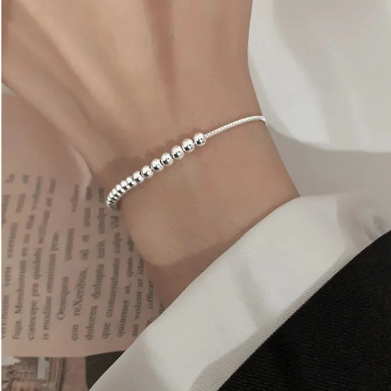 Bracciale con perline intrecciate