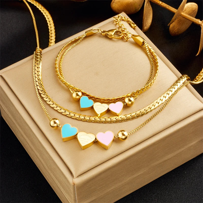 Collana a doppia catena con ciondolo 3 cuori pastello