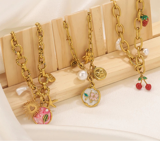 Bracciale bohémien con ciondoli – Stella marina, frutti e fiori