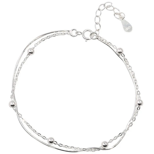 Desiderio in Argento – Bracciale Portafortuna a Doppio Strato"