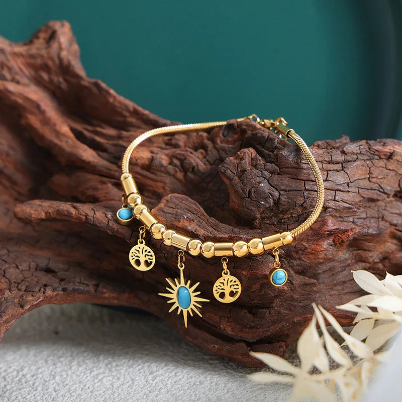 Set Collana & Bracciale Dorato con Ciondoli Sole e Turchese – Eleganza LuminosA